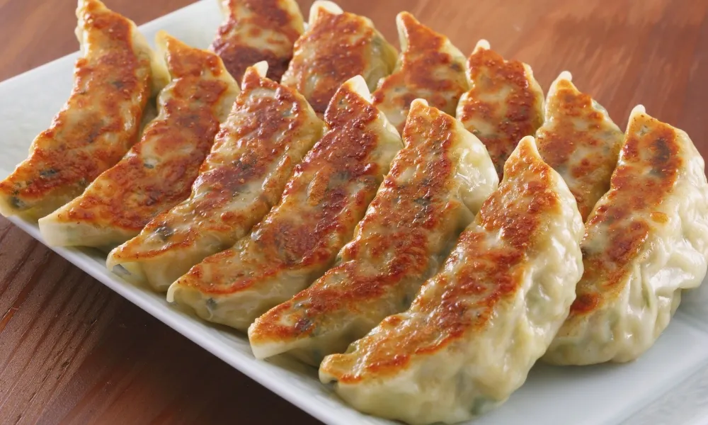Pan‑fried dumplings with golden crust at Asian Plate, a Chinese Restaurant in Arcadia